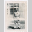 Man in US Army uniform standing in front of building (ddr-densho-332-28)