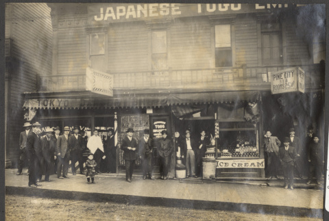 Group stands outside the Japanese Togo Employment Agency (ddr-sbbt-1-18)