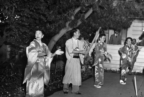 Three women and one man at Obon Festival (ddr-ajah-3-265)