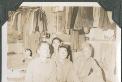 Five men sitting on cots in barracks (ddr-ajah-2-144)