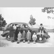 Family in front of car (ddr-densho-91-5)