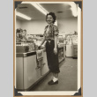 Woman standing by a counter (ddr-densho-542-121)