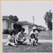 Family on lawn with dog (ddr-densho-522-112)