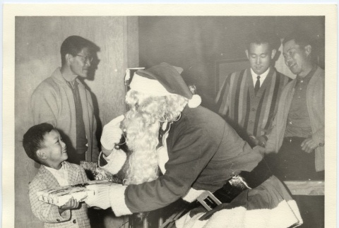 Santa giving a boy a present (ddr-jamsj-1-573)