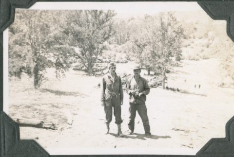 Two men standing on hillside (ddr-ajah-2-192)
