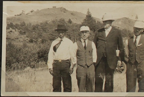 Four men in a field (ddr-densho-259-23)