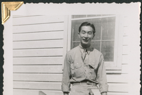 Man on stairs with clipboard (ddr-densho-434-259)