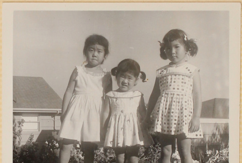 Leslie and Susan Shiomi with unidentified girl standing in yard (ddr-densho-522-492)