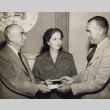 Samuel Wilder King and Elizabeth P. Farrington receiving tickets to a football game (ddr-njpa-2-284)