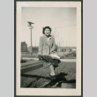 Woman sitting on rail (ddr-densho-359-145)