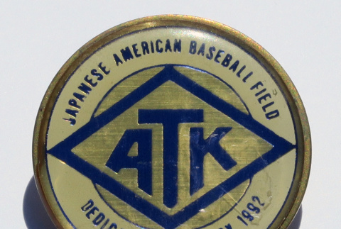 Pin commemorating dedication of the ATK Japanese American Baseball Field (ddr-ajah-5-101)