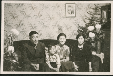 Family sitting on sofa (ddr-densho-293-118)