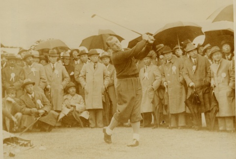 A golfer playing in front of a crowd (ddr-njpa-1-1929)