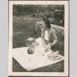Woman changing baby (ddr-densho-293-161)