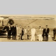 Kanekazu Okada and others posing by a plane (ddr-njpa-4-1980)