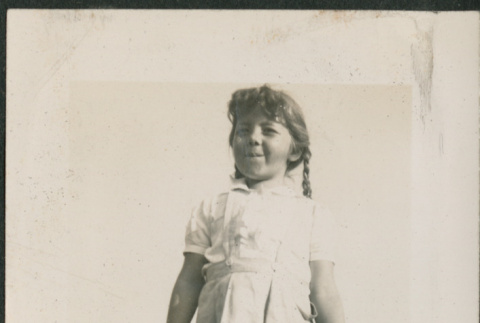Girl standing by car (ddr-densho-316-405)