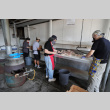 Four people preparing chicken for bbq (ddr-densho-512-116)