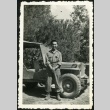 Nisei soldier in front of a jeep (ddr-densho-164-56)