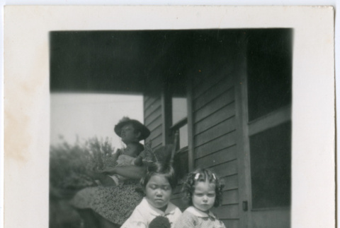 Girls on porch with dolls (ddr-densho-329-776)