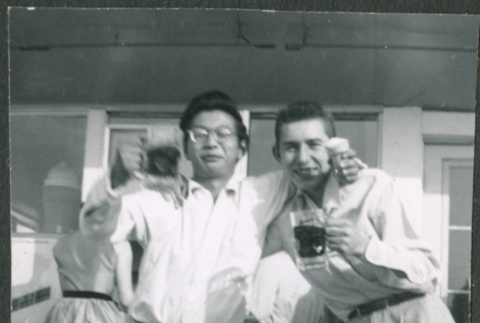 Two men drinking beer (ddr-densho-523-266)