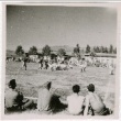 Soldiers and civilians watching a football game (ddr-densho-201-443)