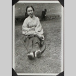 A woman seated in a park (ddr-densho-300-359)