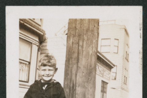 boy holding model ship (ddr-densho-378-780)