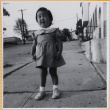 Susan Shiomi standing on sidewalk (ddr-densho-522-275)