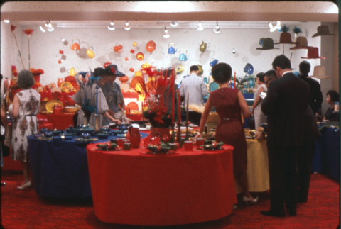Group of people by table settings display (ddr-densho-426-370)