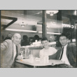Chester Sakura Sr., with man and woman at a cafe (ddr-densho-523-336)