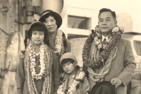 Kanekazu Okada and his family wearing leis (ddr-njpa-4-1975)