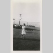Woman standing on a lawn (ddr-manz-7-111)