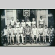 Boys basketball team outside building (Maryknoll school) (ddr-densho-330-162)