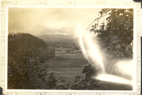 View of valley with Mt. Rainier in distance (ddr-densho-326-474)