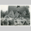 Photograph of an exhibit of textiles created at Manzanar (ddr-csujad-47-75)