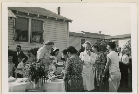 Serving refreshments at hospital event (ddr-densho-37-988)