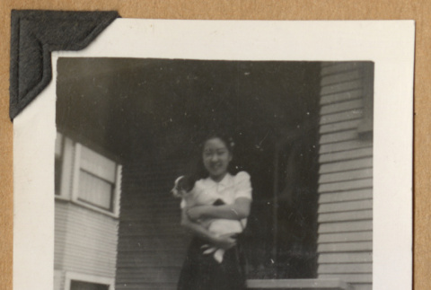 Girl holding a small dog (ddr-densho-542-230)