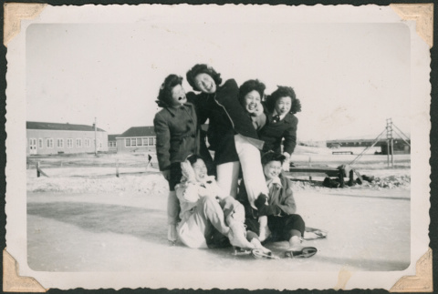 Ice skaters smile for the camera (ddr-densho-463-94)