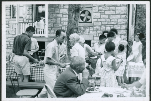Group at picnic buffet table (ddr-densho-293-178)