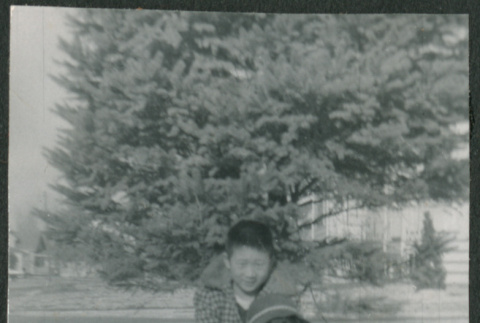 Boy hugging dog (ddr-densho-523-288)