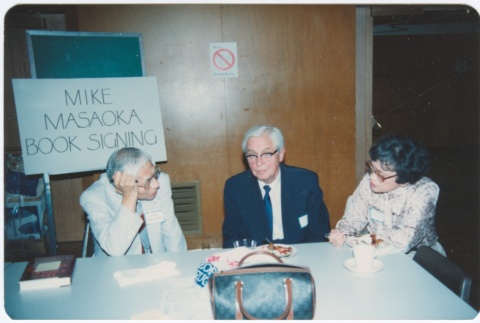 Mike Masaoka book signing table (ddr-densho-10-171)