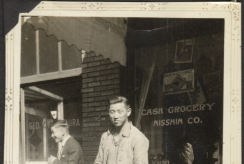Man outside Grocery store (ddr-densho-326-598)