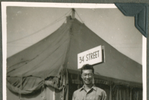 Soldier in front of tents (ddr-densho-201-534)
