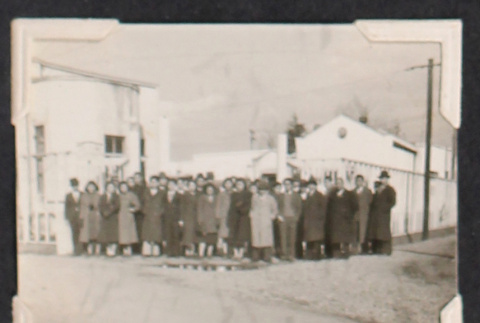 Group photo in winter coats outside buildings (ddr-densho-468-440)
