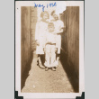 Two girls and a boy in narrow passageway (ddr-densho-483-584)