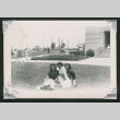 Three girls sitting on lawn (ddr-densho-550-134)