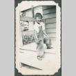 A boy standing on steps (ddr-densho-321-966)