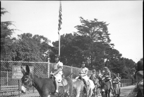 Group of children on pony ride (ddr-densho-426-962)