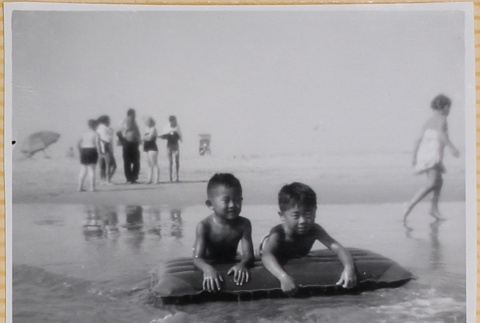 Two boys playing at beach (ddr-densho-522-288)