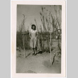 Women Standing by bare trees outside barracks (ddr-densho-329-1363)